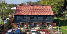 Exterior of Housewood End homes in Hemel Hempstead with cars parked outside