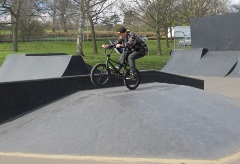 A boy on his BMX bike doing a bunny hop at Gadebridge Park skate park